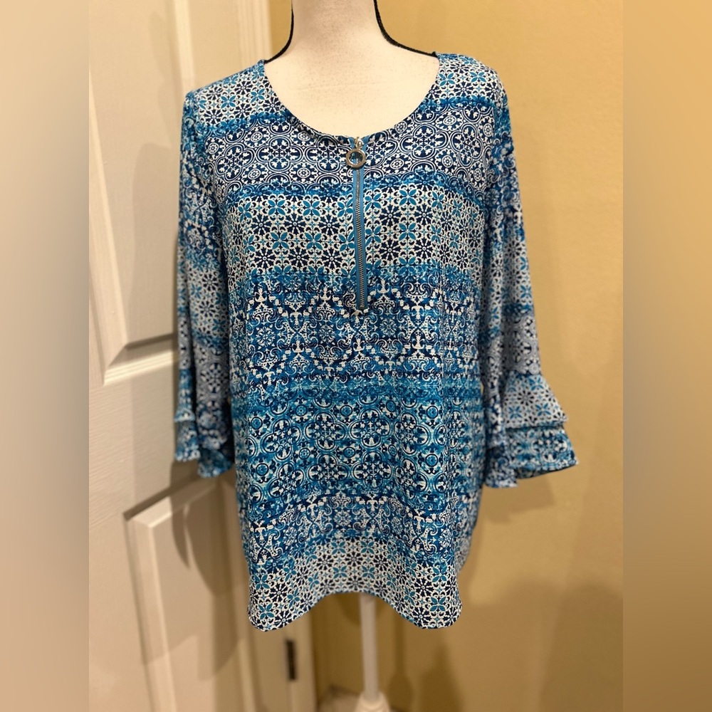 Cathy brand Ruffle Sleeve Zip neck top.